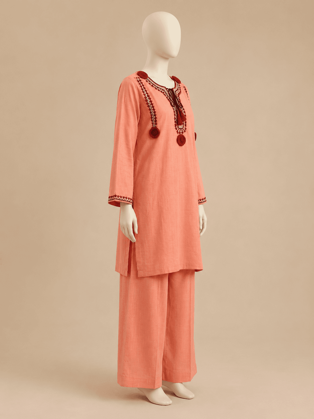 Side profile of the Gulnar coral kurta and wide-leg trousers